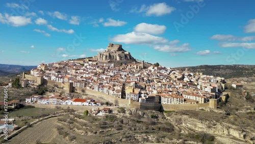 Cinematic aerial view of Morella city. Ancient walled city located on a hill-top in the province of Castellón, Valencian Community, Spain. Drone going forward. Famous travel destination. photo