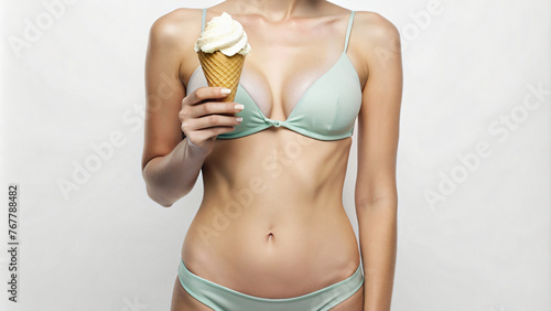 A woman wearing a bikini holds a ice cream