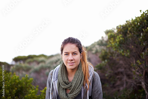 Portrait, hiking and woman outdoor for travel, vacation or adventure in Australia. Face, trekking and young person in nature for holiday, journey and explore environment on mockup space in winter
