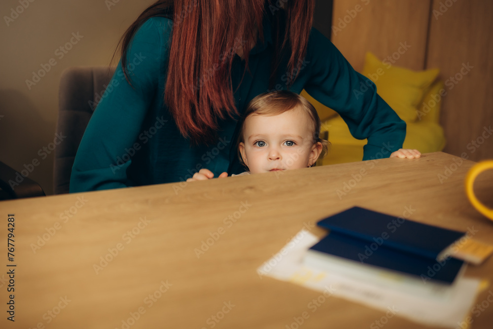 a little girl in a travel agency a little girl in a travel agency