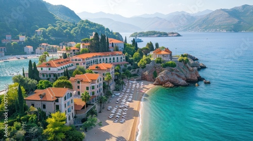 Aerial view A luxury hotel on the sea coast with clear blue water, boats, pier, hotel and green trees in summer on a sunny day