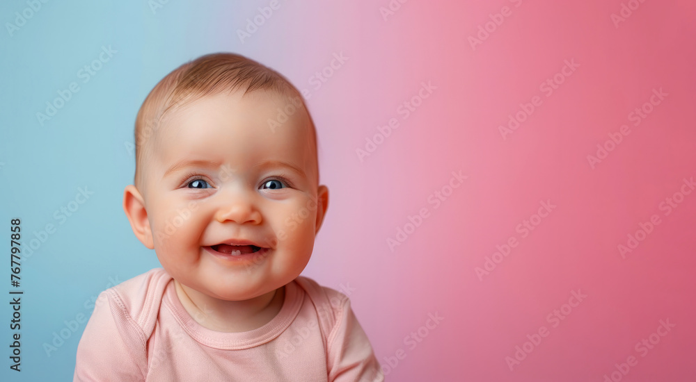A baby is smiling and looking at the camera. baby is wearing a pink shirt. The background is a blue and pink color. Studio portrait of cute little baby infant smiling on different colours background A baby is smiling and looking at the camera. baby is wearing a pink shirt. The background is a blue and pink color. Studio portrait of cute little baby infant smiling on different colours background