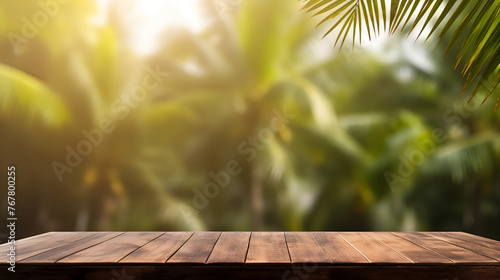 Perspective wood and bokeh light background  empty wooden table top with blur background of  rain forest with summer palm tree