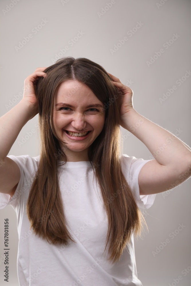 Portrait of beautiful woman on gray background Portrait of beautiful woman on gray background