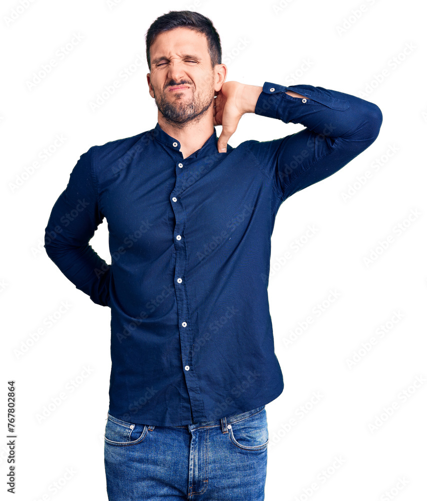 Young handsome man wearing casual shirt suffering of neck ache injury, touching neck with hand, muscular pain Young handsome man wearing casual shirt suffering of neck ache injury, touching neck with hand, muscular pain