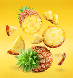 Ripe pineapple and pineapple slices isolated on white background. File contains clipping path.