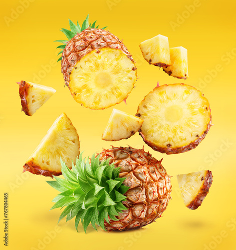 Ripe pineapple  and pineapple slices isolated on white background. File contains clipping path. © volff