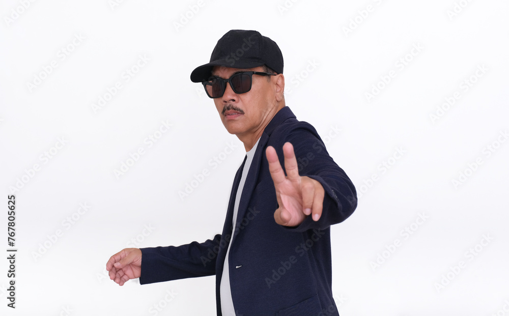 Confident facial expression of a soccer coach showing his two fingers strategy Confident facial expression of a soccer coach showing his two fingers strategy