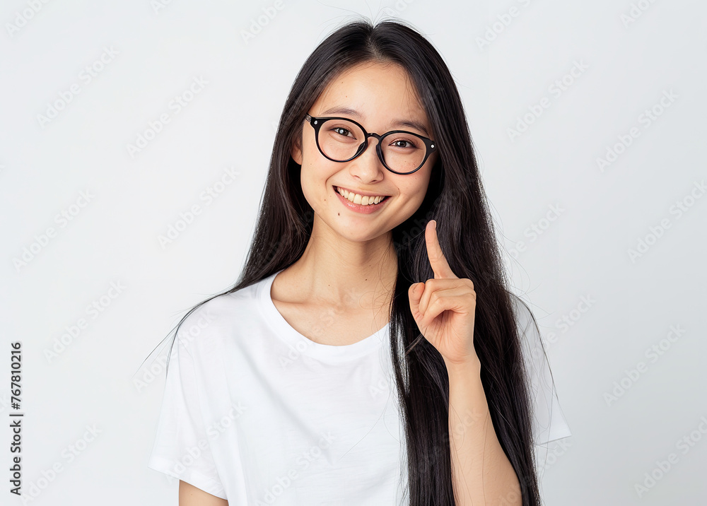 A realistic photo of an Japanese artist with long straight black hair, wearing glasses and a white t-shirt pointing at something on the side with her right hand, with a smiling facial expression A realistic photo of an Japanese artist with long straight black hair, wearing glasses and a white t-shirt pointing at something on the side with her right hand, with a smiling facial expression