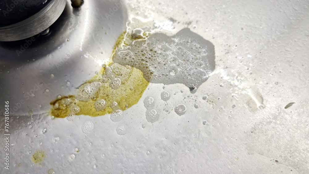 Disgusting greasy stain being sprayed with cleaning detergent, dirty