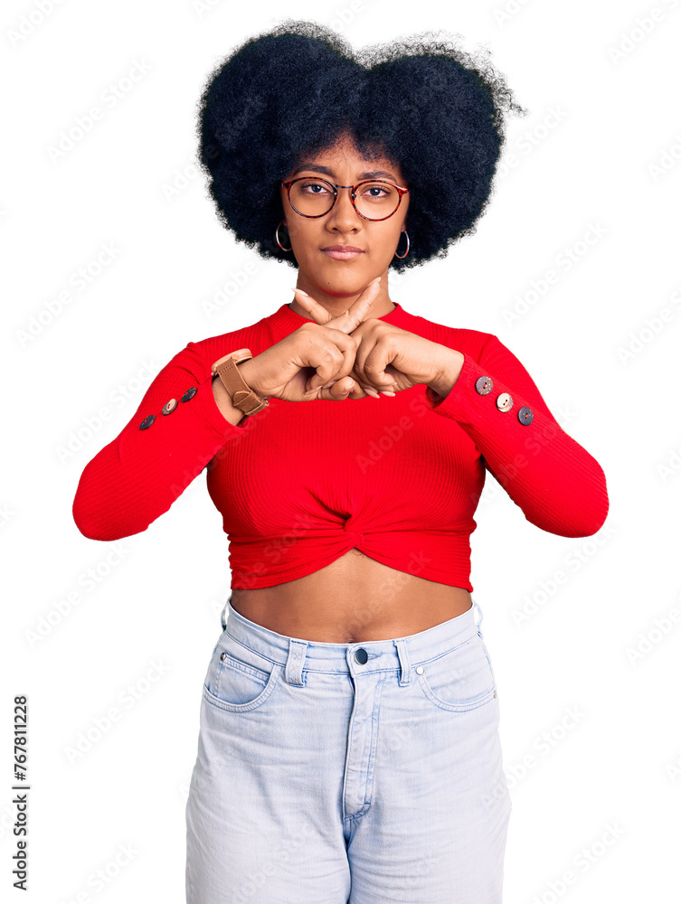 Young african american girl wearing casual clothes and glasses rejection expression crossing fingers doing negative sign Young african american girl wearing casual clothes and glasses rejection expression crossing fingers doing negative sign