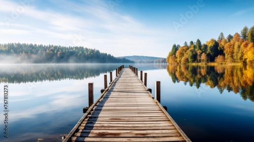 Wooden pier leading into lake, surrounded by the beauty of nature, tranquil scenery