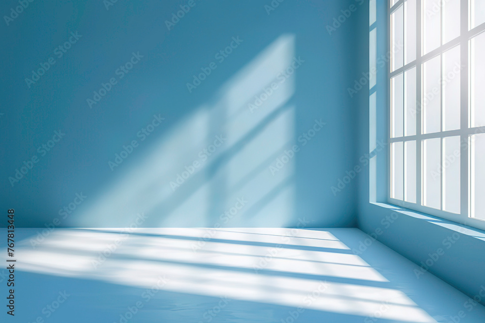 Blue background with shadows of window on the floor Blue background with shadows of window on the floor