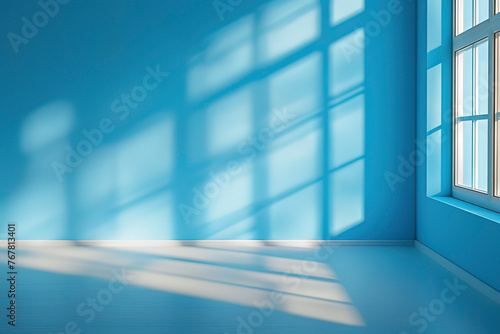 Blue background with shadows of window on the floor