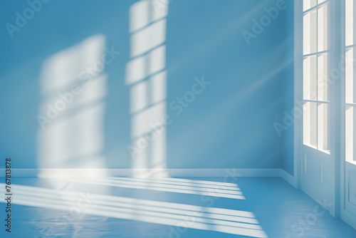 Blue background with shadows of window on the floor