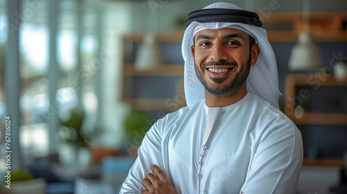 A smiling Emirati businessman Wearing UAE Emirati Traditional Dress, Emirati kandura, stands in his office, Arabian man in the Emirates, generative ai. photo
