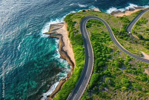 A winding road with a beautiful ocean view in the background
