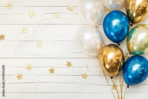Holiday background with balloons on white wooden background