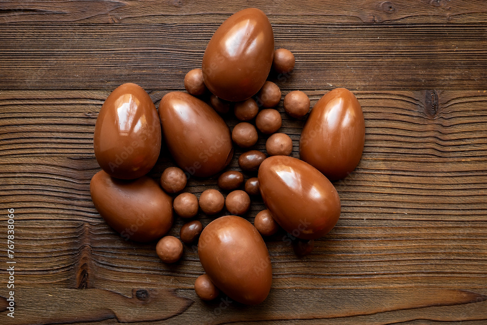 Chocolate eggs and sweets flat lay. Chocolates background