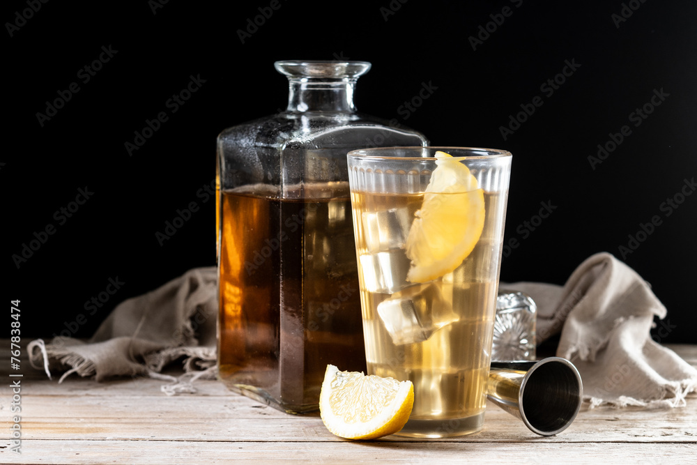 Highball, Whiskey with soda and lemon beverage on wooden table Highball, Whiskey with soda and lemon beverage on wooden table