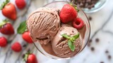 Two Scoops of Chocolate Ice Cream With Strawberries