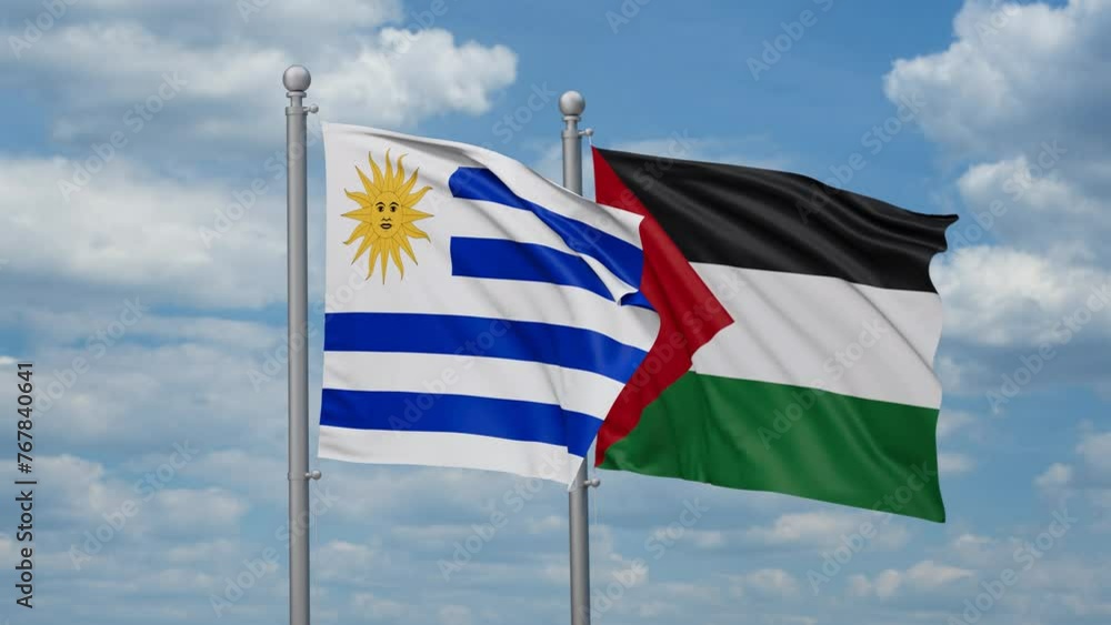 Palestine and Gaza Strip and Uruguay two flags waving together on blue sky, looped video Palestine and Gaza Strip and Uruguay two flags waving together on blue sky, looped video