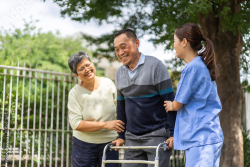Female healthcare professional providing at home medical care to elderly man with smile, senior patient, nursing, listens attentively to nurse, elderly care, home health services, patient at home