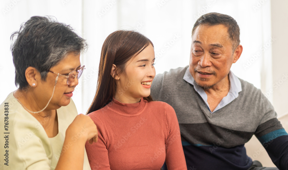 Portrait enjoy happy smiling love asian family.Senior mature father hug with elderly mother and young adult woman play laughing and having fun together at home.insurance concept Portrait enjoy happy smiling love asian family.Senior mature father hug with elderly mother and young adult woman play laughing and having fun together at home.insurance concept