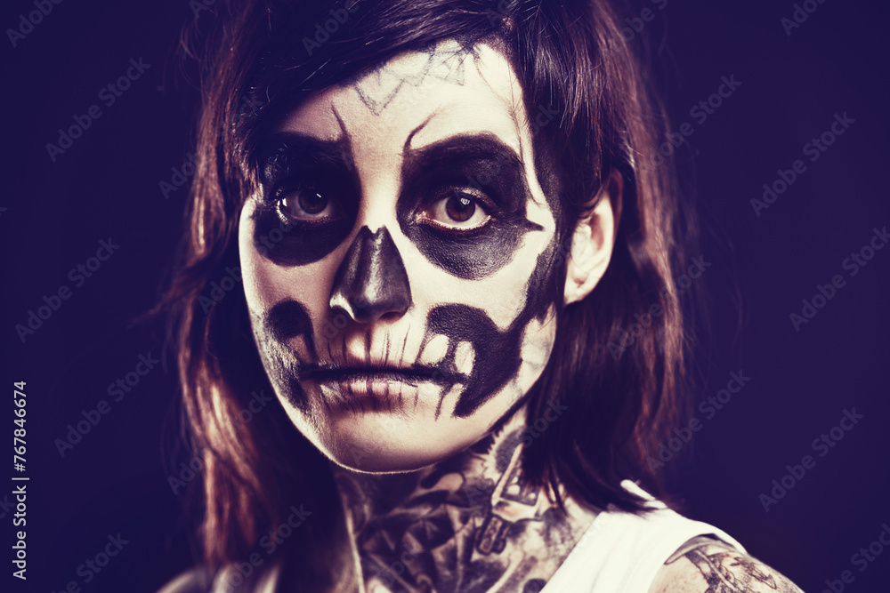 Skull, makeup and portrait of woman on black background for festival, Halloween and day of the dead. Creative art, skeleton and person with face paint for horror, scary and gothic aesthetic in studio