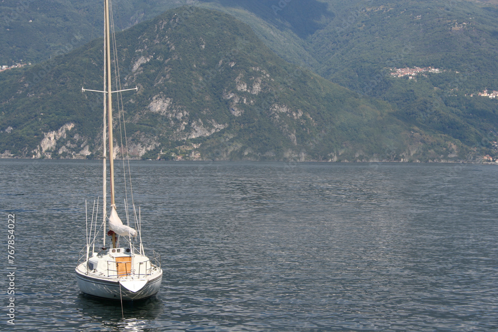 Small sailing boat on the waters of Lake Como..