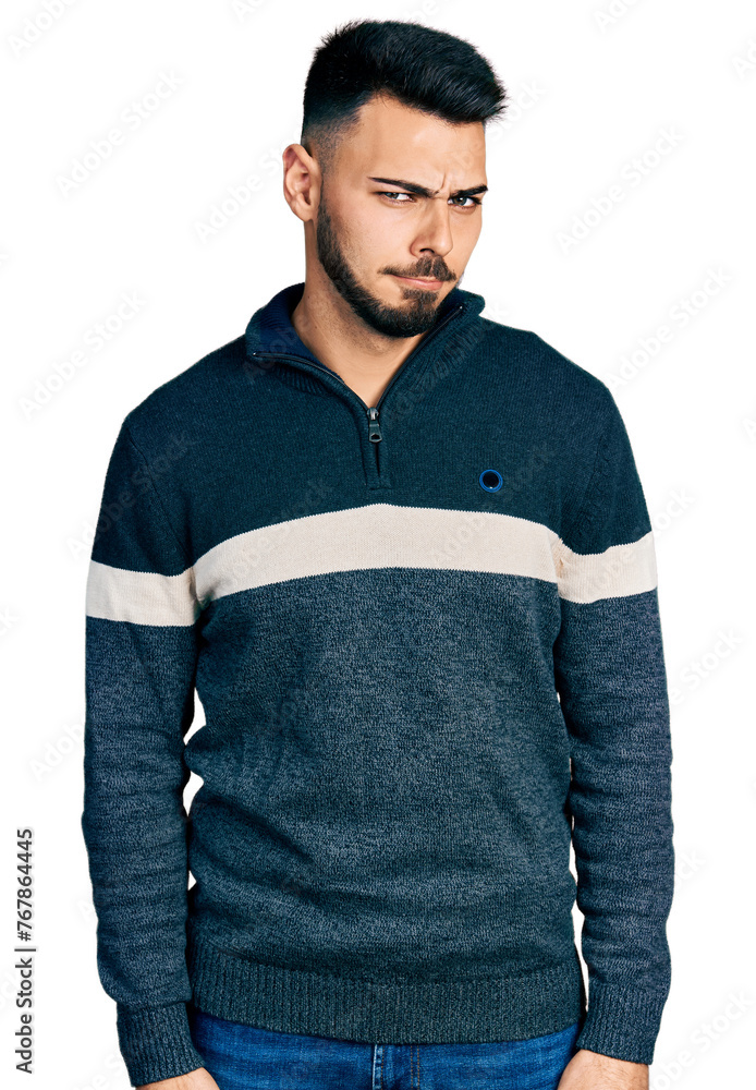Fototapeta premium Young hispanic man with beard wearing casual winter sweater skeptic and nervous, frowning upset because of problem. negative person.
