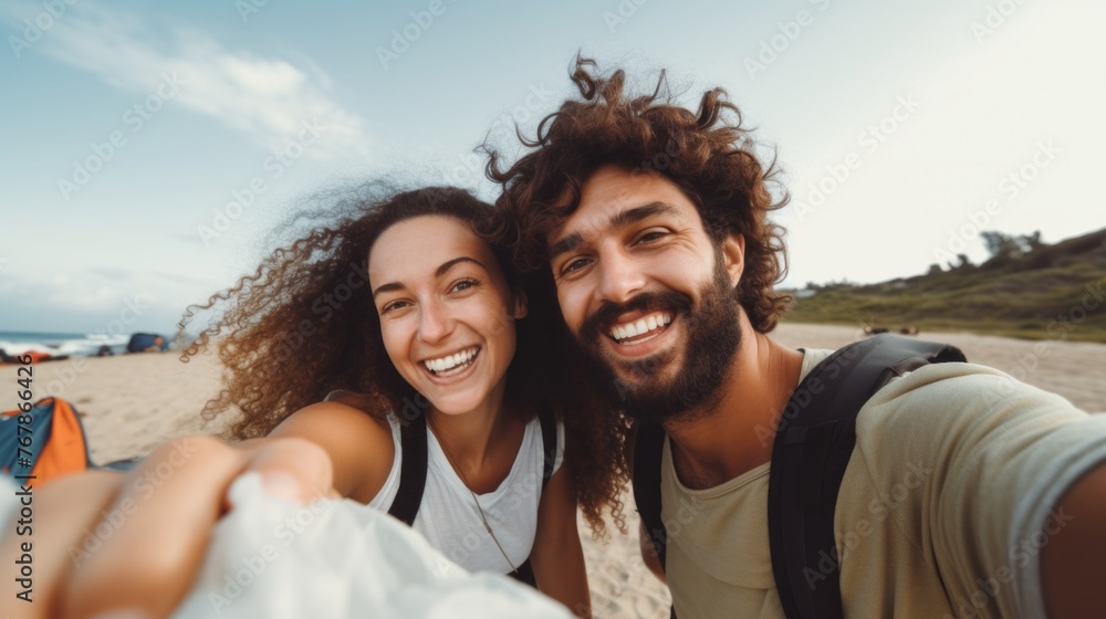 Fototapeta premium A man and woman are smiling for a picture on a beach