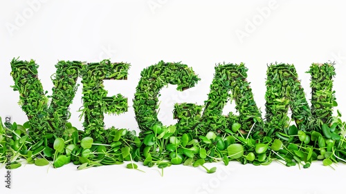 word vegan written in grass and leaves