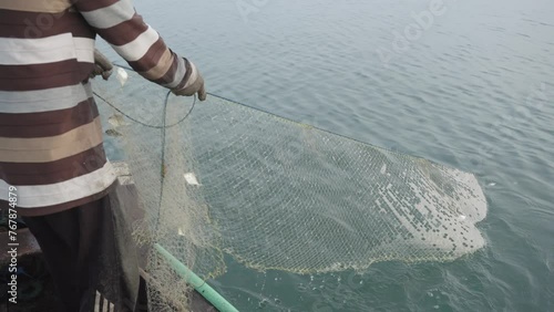 From their traditional boats, fishermen pull nets with almost no catch. It's tough out there. Pollution and overfishing make it hard to find fish. 