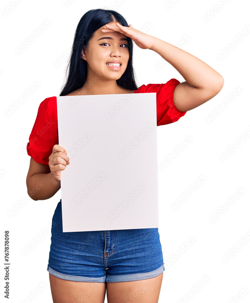 Young beautiful asian girl holding blank empty banner stressed and frustrated with hand on head, surprised and angry face Young beautiful asian girl holding blank empty banner stressed and frustrated with hand on head, surprised and angry face