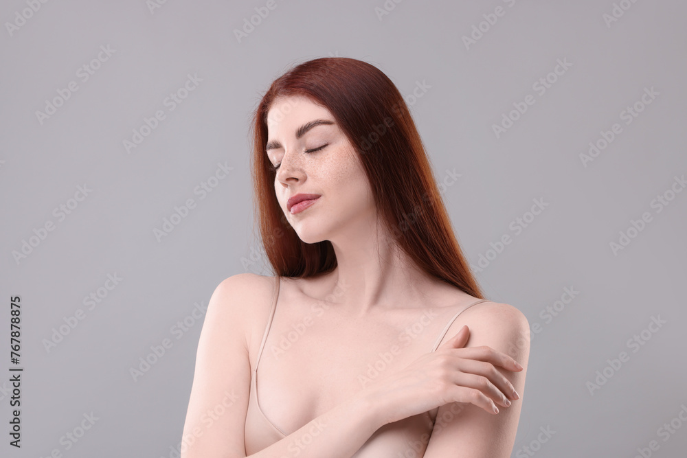 Portrait of beautiful woman on grey background Portrait of beautiful woman on grey background