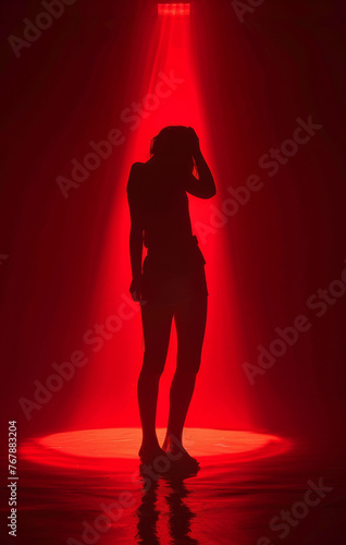 The Illusion of Solitude: Teen's Silhouette in Dark Red 