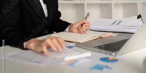 Documents, Business woman and accountant reading report for information, financial data or analysis. Paperwork, auditor check, review and bookkeeping, Calculate finance and tax in office