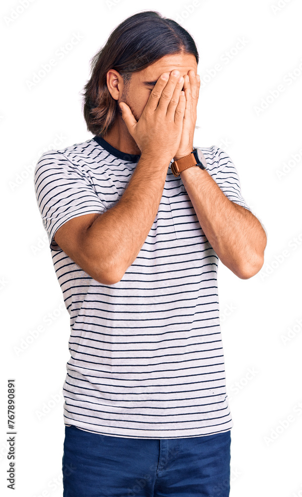 Young handsome man wearing casual clothes with sad expression covering face with hands while crying. depression concept. Young handsome man wearing casual clothes with sad expression covering face with hands while crying. depression concept.