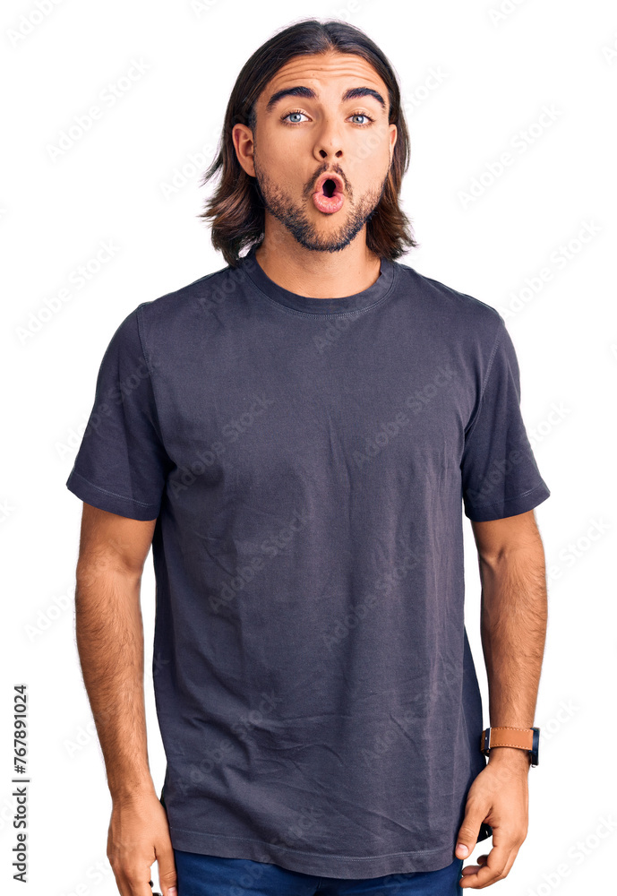 Young handsome man wearing casual clothes scared and amazed with open mouth for surprise, disbelief face Young handsome man wearing casual clothes scared and amazed with open mouth for surprise, disbelief face