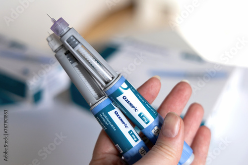Hand holding Ozempic Insulin injection pen for diabetics. Denmark - March 25, 2024