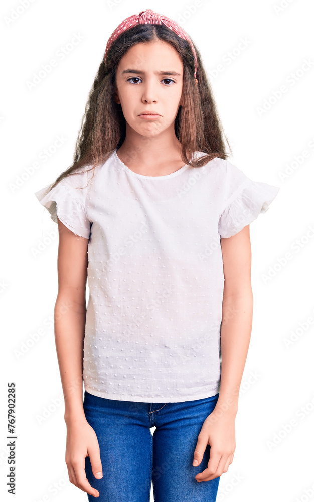 Cute hispanic child girl wearing casual white tshirt depressed and worry for distress, crying angry and afraid. sad expression. Cute hispanic child girl wearing casual white tshirt depressed and worry for distress, crying angry and afraid. sad expression.