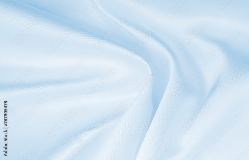 Smooth elegant blue silk or satin luxury cloth texture as abstract background. Luxurious background design Smooth elegant blue silk or satin luxury cloth texture as abstract background. Luxurious background design