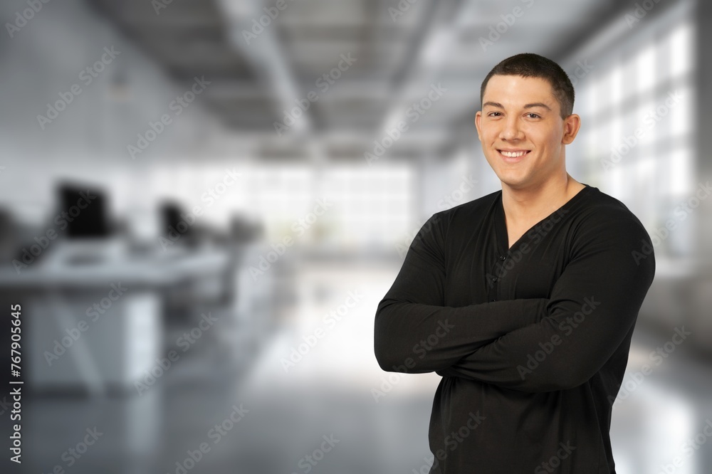 Fototapeta premium Happy young businessman leader standing in office.