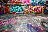 Vibrant Urban Graffiti Art Covering Walls and Floor of Abandoned Building