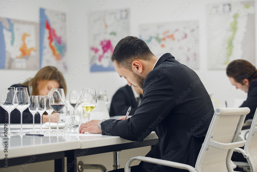 Fototapeta premium Sommelier school. Professional wine waiters are trained. Winemaking courses, wine tasting. 