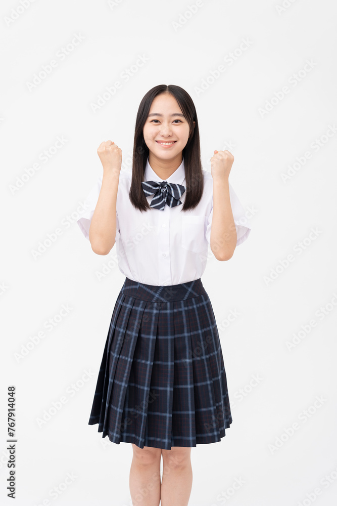 制服を着た日本人女子高校生/ガッツポーズ/白背景スタジオ撮影 制服を着た日本人女子高校生/ガッツポーズ/白背景スタジオ撮影