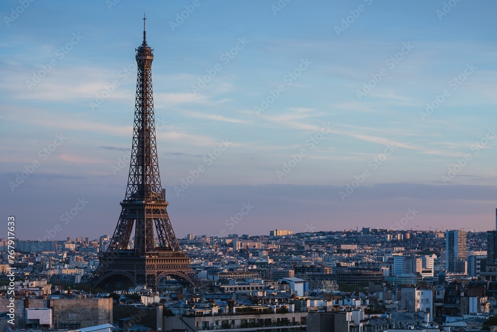 Stunning sunset view of the Eiffel Tower and nearby buildings in Paris, France