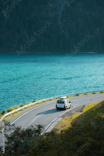 Cuadro en lienzo a van on the road by the water driving along the ocean