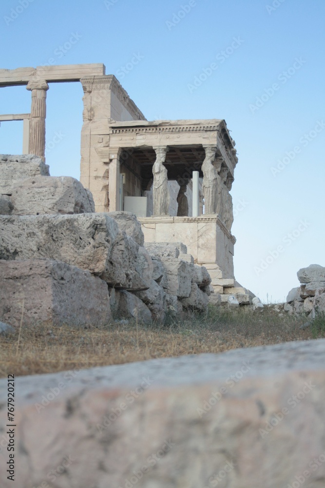 Ruins featuring stately stone pillars and majestic arches